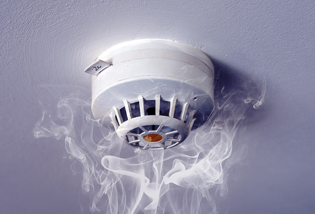 Smoke alarm with smoke around it